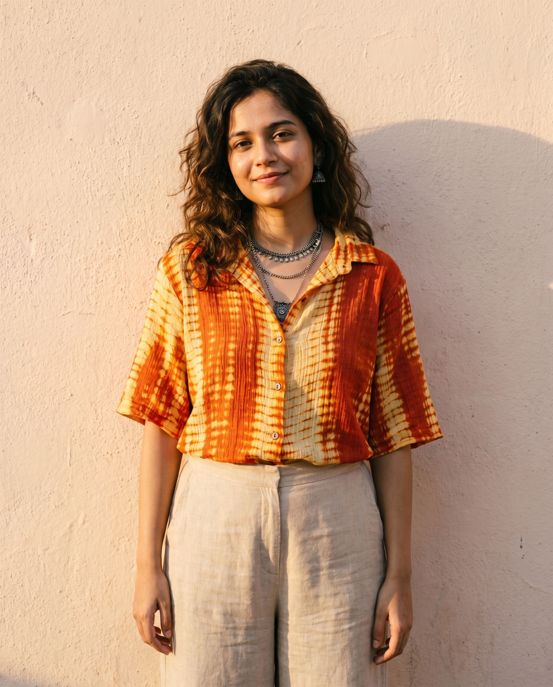 Woman wearing The Sunset Shibori, ochre and orange shibori dye